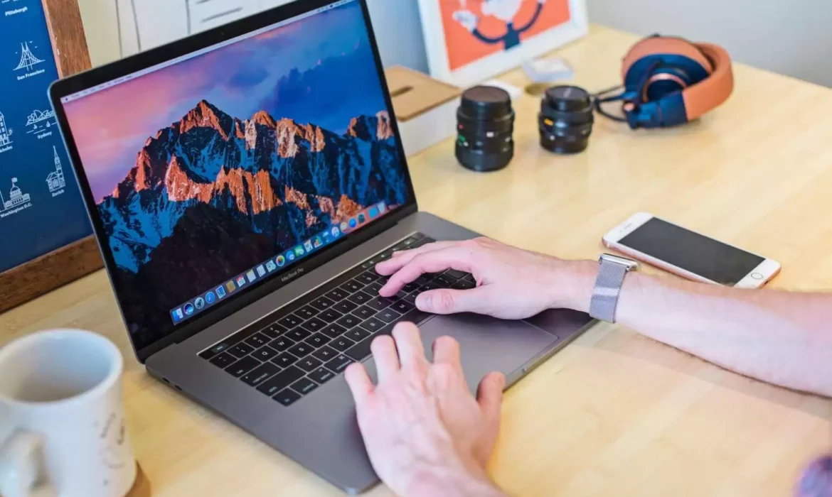 apple macbook with iphone on table